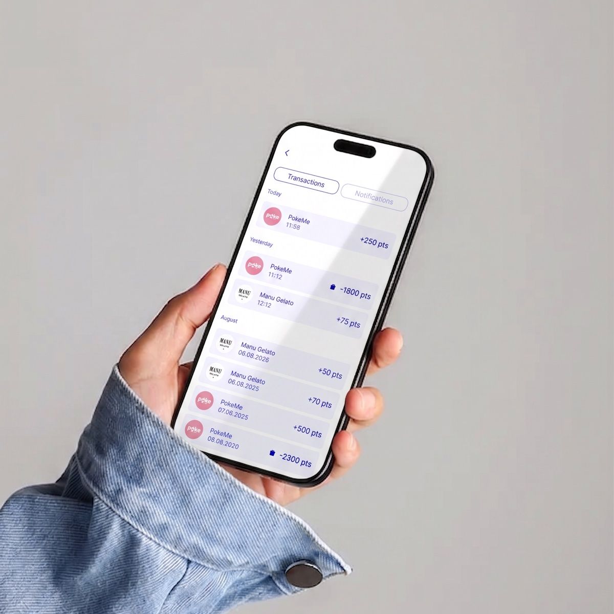 La page Transactions de l'app Badger : les points gagnés et dépensés, avec la date et le commerce